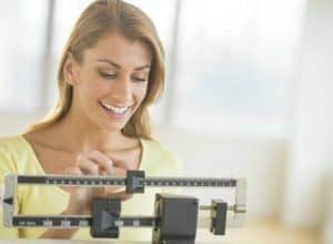 women-on-scale-weight-loss-fitness 3